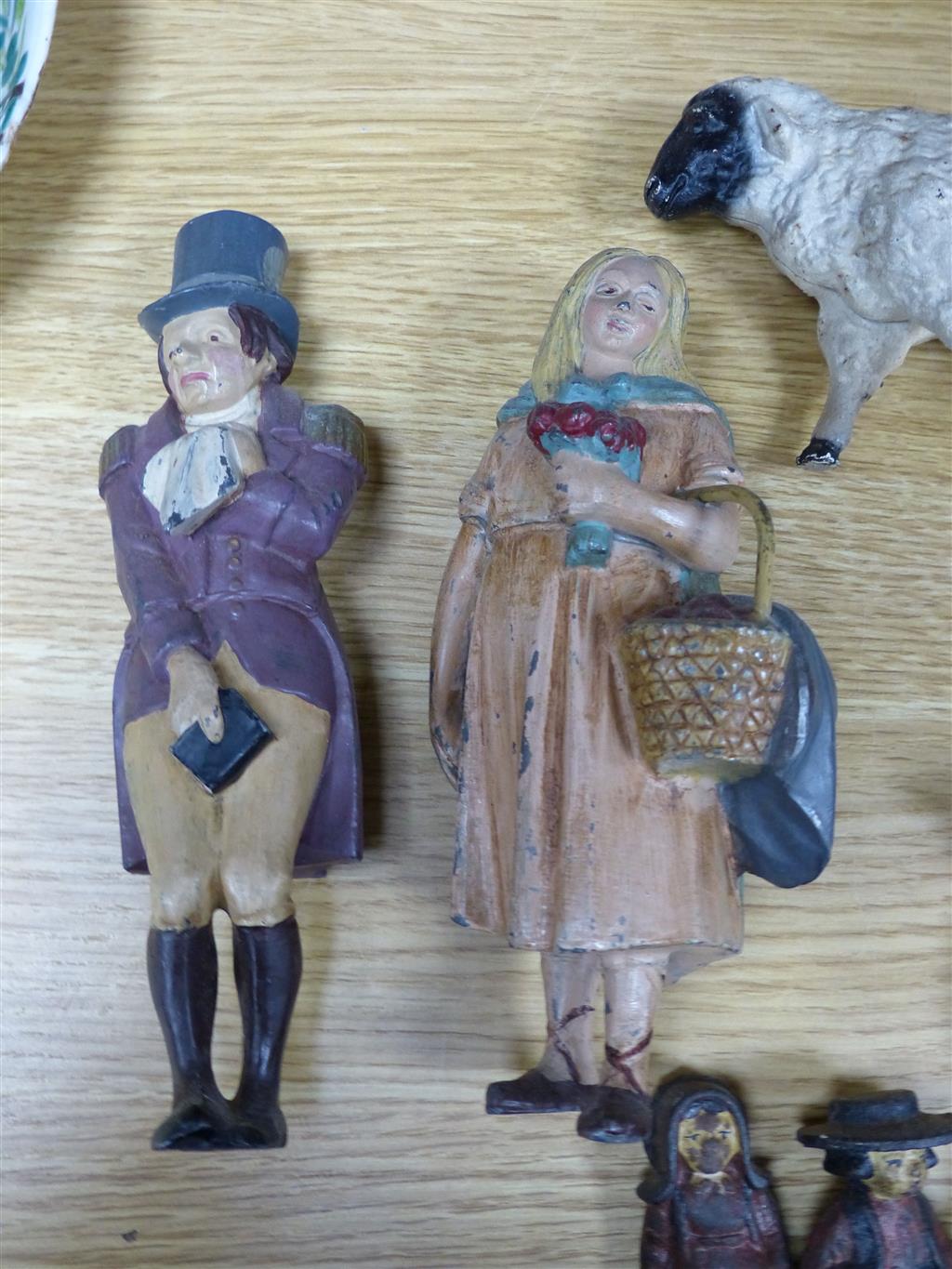 A group of American? painted cast iron and metal Amish figures, sheep money box etc.